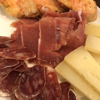 Rekons - Tapas plate -- not bad (bread with tomato and oil, ham, cheese, sausage) but left a lot to be desired. Stick with the amazing empanadas. - Argentine Near Me - Barcelona, B Rekons - Tapas plate -- not bad (bread with tomato and oil, ham, cheese, sausage) but left a lot to be desired. Stick with the amazing empanadas. - Argentine Near Me - Barcelona, B