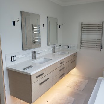 Schroeder Woodwerks - floating cabinet with lighted flush vanity cabinets and towel warmer. - General Contractors Near Me Schroeder Woodwerks - floating cabinet with lighted flush vanity cabinets and towel warmer. - General Contractors Near Me