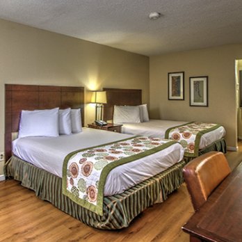 The Guest Lodge - 2 Queen Room - Microwave, refrigerator, coffeemaker, complimentary WiFi, work area, ergonomic chair - Hotels Near Me - Gainesville, Georgia