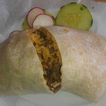Rivas Taqueria - A very loosely wrapped steak burrito that came sliced up the middle. - Mexican Near Me - Wallingford, Connecticut