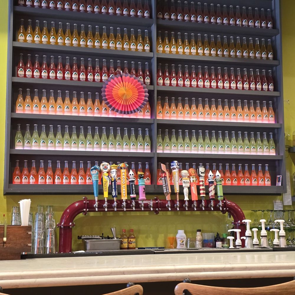 Behind the bar. Behind the bar.