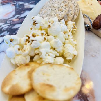 Coco Noir Wine Shop & Bar - Popcorn comes with the charcuterie board - Wine Bars Near Me - Oakland, California Coco Noir Wine Shop & Bar - Popcorn comes with the charcuterie board - Wine Bars Near Me - Oakland, California