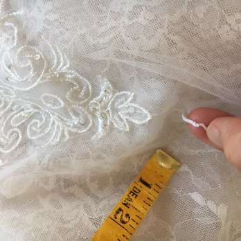 Unique Alterations - That little piece of thread is what is left of the bustle. (Just one little loop). A staple or duct tape would've been more effective! - Sewing & Alterations Near Me - Anaheim, California