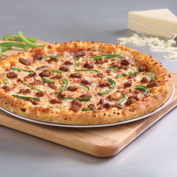 Domino's Pizza - a pizza on a cutting board - Pizza Near Me - Barrie, Ontario Domino's Pizza - a pizza on a cutting board - Pizza Near Me - Barrie, Ontario