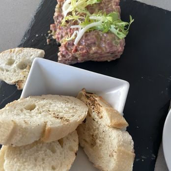 Brigitte Bistro - Partially eaten beef tartare - delicious, but note the oddly un(toasted?) baguettes - French Near Me - Red Hook, New York