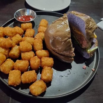 Leahi Bar & Grill - Burger on taro bun (sub fries for tots) - Bars Near Me - Honolulu, Hawaii