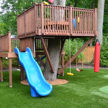 WMT Construction - a tree house with a slide - General Contractors Near Me