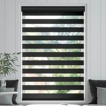 Carpet King - a modern living room with black and white striped blinds - Flooring Near Me