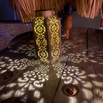 The Jerk - the shadow of a candle on the floor - Caribbean Near Me - Key West, Florida