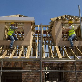 Rony's Construction - two men working on a roof - Masonry/Concrete Near Me