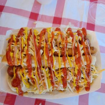 Doggin' It - hot dog covered in ketchup and mustard - Hot Dogs Near Me Doggin' It - hot dog covered in ketchup and mustard - Hot Dogs Near Me