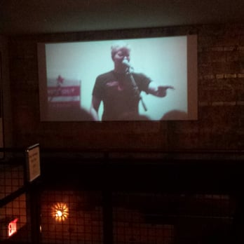 Nitehawk Cinema - Waiting area and bar screen - Cinema Near Me - Brooklyn, New York Nitehawk Cinema - Waiting area and bar screen - Cinema Near Me - Brooklyn, New York