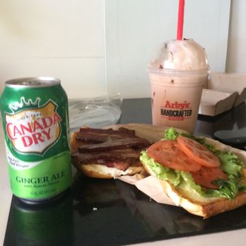 Arby's - 3 paper-thin slices of tomato on BLT. (Soda can for size comparison) some lettuce wilted  $9 for sand & shake - Fast Food Near Me - Anaheim, California