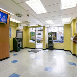 Payomatic - Customer waiting area and entrance inside PAYOMATIC store located at 590 Eight Ave New York, NY 10018