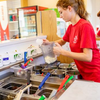 Smoothie King - a woman in a red shirt preparing food - Juice Bars & Smoothies Near Me - Ruston, Louisiana Smoothie King - a woman in a red shirt preparing food - Juice Bars & Smoothies Near Me - Ruston, Louisiana