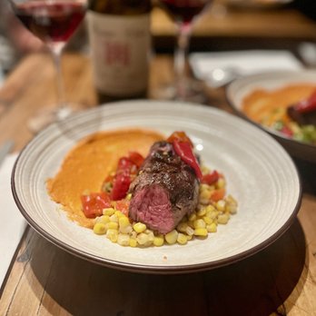 Mr Pollo - Hangars steak with romesco sauce, roasted corn, various pickled peppers, and cherry tomato - New American Near Me - San Francisco, California