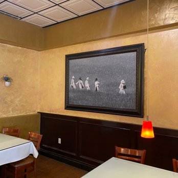I Luv Pho Preston - a dining room with a painting on the wall - Vietnamese Near Me - Dallas, Texas I Luv Pho Preston - a dining room with a painting on the wall - Vietnamese Near Me - Dallas, Texas