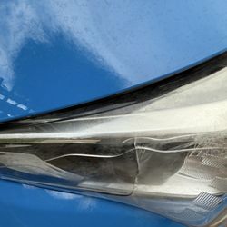 Downtown Subaru of Oakland - Service - A cracked outer assembly for a headlight that is apparently appraised at twice the listed price from factory direct.