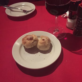 Italian Cafe - Garlic rolls (free) and House Cabernet. Bread is awesome!!!! Comes with 4. We got 2 helpings! Yummy!!! - Italian Near Me - Spring, Texas