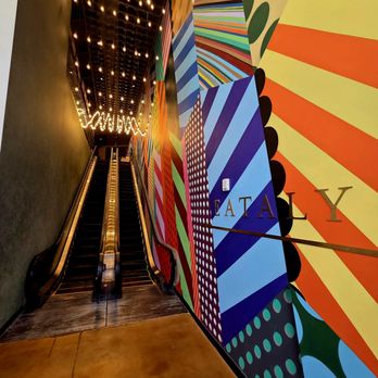 Eataly Aventura - The escalator next to the colorful wall - Grocery Near Me - Aventura, Florida Eataly Aventura - The escalator next to the colorful wall - Grocery Near Me - Aventura, Florida