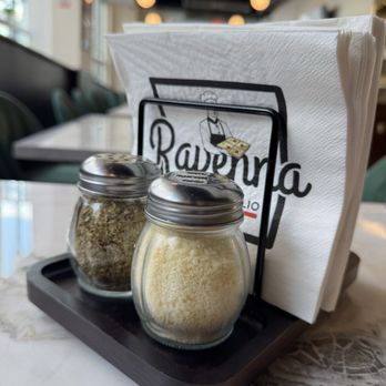 Ravenna Pizza - Oregano, Parmesan and red chili flakes on each table - Pizza Near Me - Arlington, Virginia Ravenna Pizza - Oregano, Parmesan and red chili flakes on each table - Pizza Near Me - Arlington, Virginia