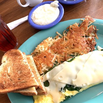 Carolina’s Diner - Spinach Omelet (swapped out the feta cheese for swiss) Sourdough bread. Hash browns and grits - Diners Near Me - High Point, North Carolina