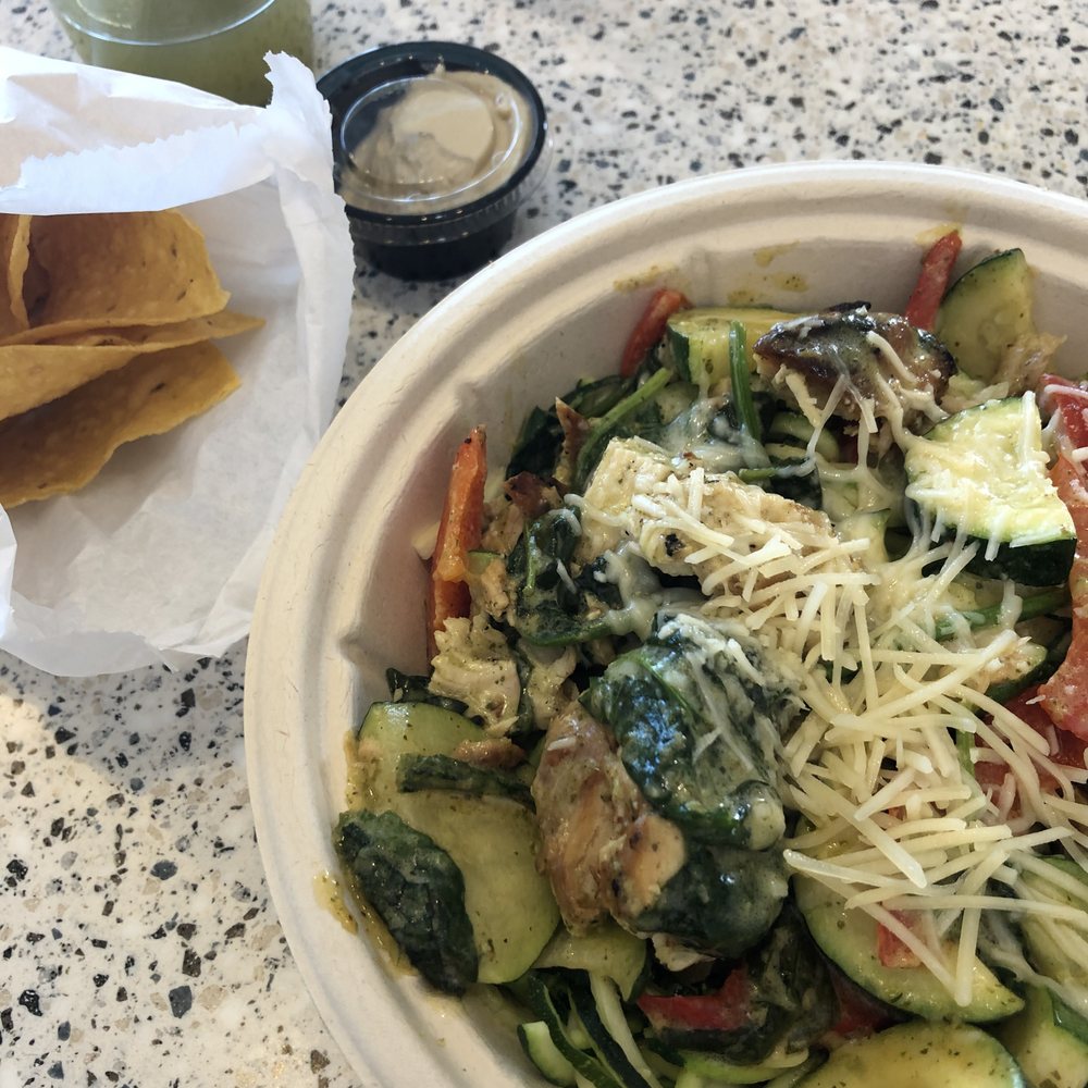 Crazy Bowls & Wraps - Pesto Bowl with Cucumber Matcha Tea, Chips, and Hummus - Salad Near Me - Saint Charles, Missouri Crazy Bowls & Wraps - Pesto Bowl with Cucumber Matcha Tea, Chips, and Hummus - Salad Near Me - Saint Charles, Missouri