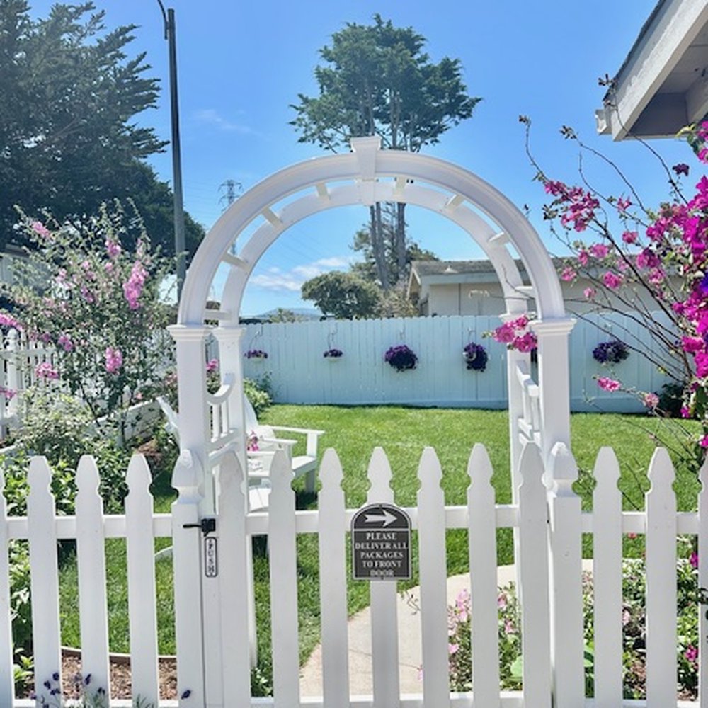 Speedy Gonzalez Landscapes - Picket Fence Arch installed at gate. - Landscaping Near Me