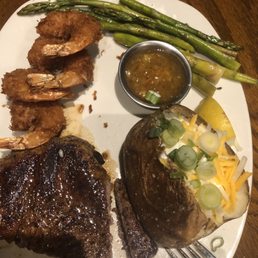 9 OZ Sirloin Steak and Coconut Shrimps with 2 Sides. 9 OZ Sirloin Steak and Coconut Shrimps with 2 Sides.