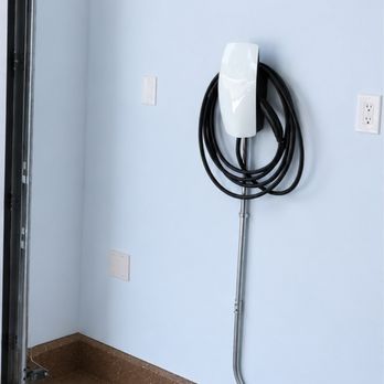 Hardwired Electric Services - Installed one customer-supplied wall-mounted Level 2 EV charger in the garage. - Electricians Near Me Hardwired Electric Services - Installed one customer-supplied wall-mounted Level 2 EV charger in the garage. - Electricians Near Me