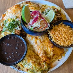 3 Mariachis - Platter with enchilada, beef burrito, and chorizo tacos with rice and beans.
