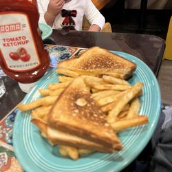 Grilled cheese sandwich with fries