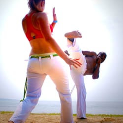 Capoeira Barro Vermelho - Mestre Bomba and a student, Vermelha, capoeira on the beach.