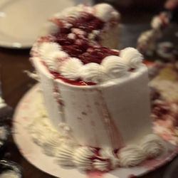 Around the World Bakery - White cake with fresh raspberry and butter cream frosting.