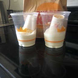 two cups of yogurt on a stove two cups of yogurt on a stove