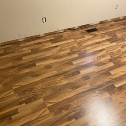 JRM Contracting Services - installing flooring and baseboard