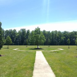 Saint Therese at St. Mary of the Woods - Back of St. Mary's, middle tree pays homage to a member of the community that passed away. Planted in his memory.