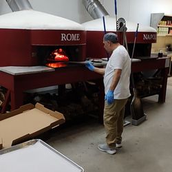 Itala Pizza - Pizza going into the 900+ degree oven