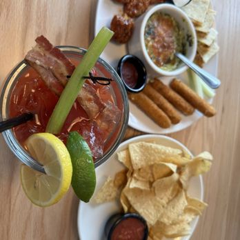 Applebee's Grill + Bar - Ultimate Trio - Boneless wings, Mozzarella sticks, Spinach & Artichoke Dip and Bloody Mary - American Near Me - Menomonee Falls, Wisconsin Applebee's Grill + Bar - Ultimate Trio - Boneless wings, Mozzarella sticks, Spinach & Artichoke Dip and Bloody Mary - American Near Me - Menomonee Falls, Wisconsin