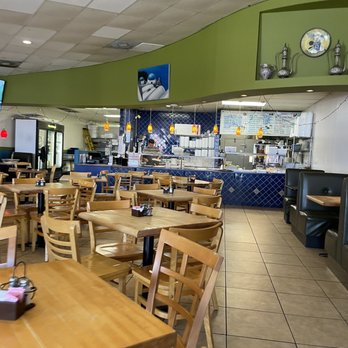 Zorba - a restaurant with tables and chairs - Greek Near Me - Round Rock, Texas