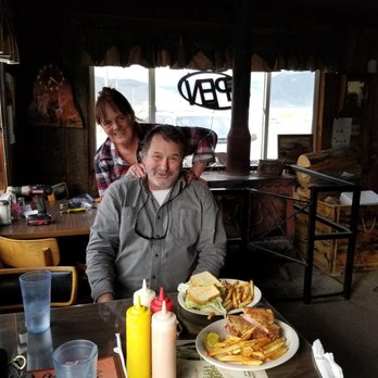 Silver Dollar Bar & Restaurant - a man and a woman sitting at a table with plates of food - Cafes Near Me - Leadore, Idaho Silver Dollar Bar & Restaurant - a man and a woman sitting at a table with plates of food - Cafes Near Me - Leadore, Idaho