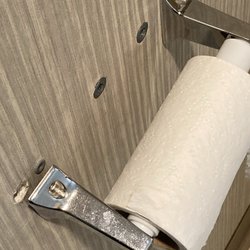 Toilet roll coming off the wall