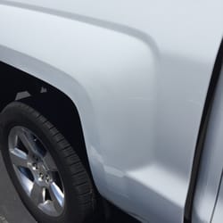 Paintless Dent Shop - This was the after effects! The reflections are from the stripes on the parking lot, they are not dents or scratches....