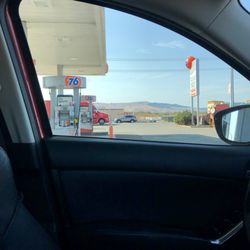 76 - From car parked at gas pumps looking towards what I believe is Canyon Road