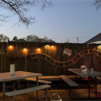 CrawBillys on the Tracks - a wooden deck with tables and benches - Burgers Near Me - Pelahatchie, Mississippi CrawBillys on the Tracks - a wooden deck with tables and benches - Burgers Near Me - Pelahatchie, Mississippi