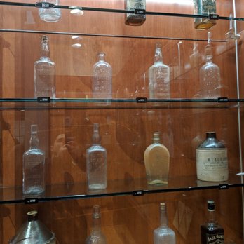 The Jack Daniel Distillery - Jack Daniels bottles throughout the years - Distilleries Near Me - Lynchburg, Tennessee
