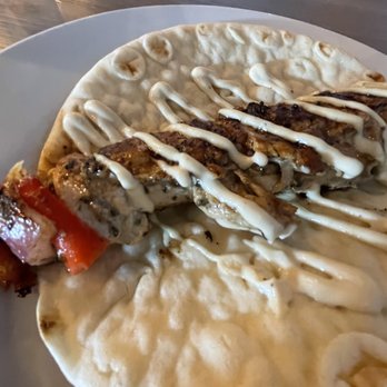 The Toast - Chicken kebab dish served over rice with a pita. - Salad Near Me - Surprise, Arizona