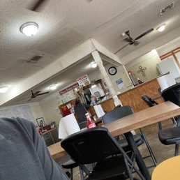 a man sitting at a table in a restaurant