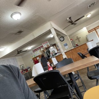 Hamburger Happiness - a man sitting at a table in a restaurant - Hot Dogs Near Me - Minden, Louisiana