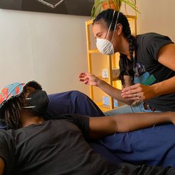 Philadelphia Community Acupuncture - Erin treating Muhammad